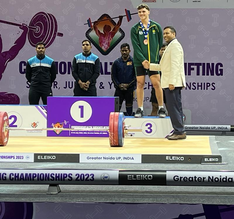 Medal ceremony podium at the Commonwealth Weightlifting Championships 2023, Greater Noida
